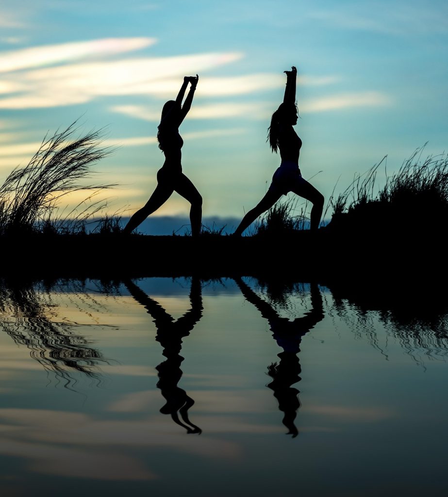 women, yoga, silhouettes, water, reflection, mirroring, water reflection, pose, posing, yoga pose, meditation, stretching, wellness, well-being, exercise, adults, asia, girls, nature, morning, outdoors, pair, people, stance, sunrise, sunset